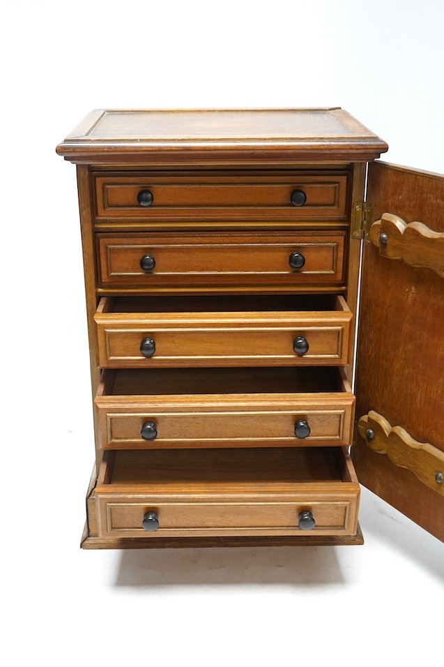 A pair of Victorian Aesthetic period oak table top cabinets, each with five drawers, 38cm high. Condition - fair to good